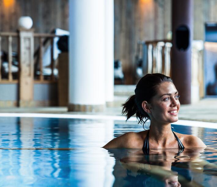 woman in hotel indoor pool