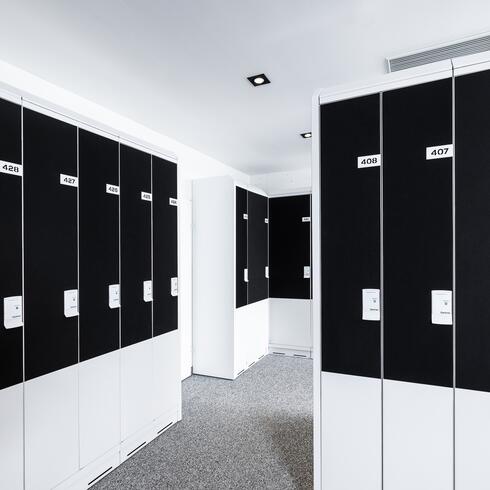Modern black and white lockers in a hallway